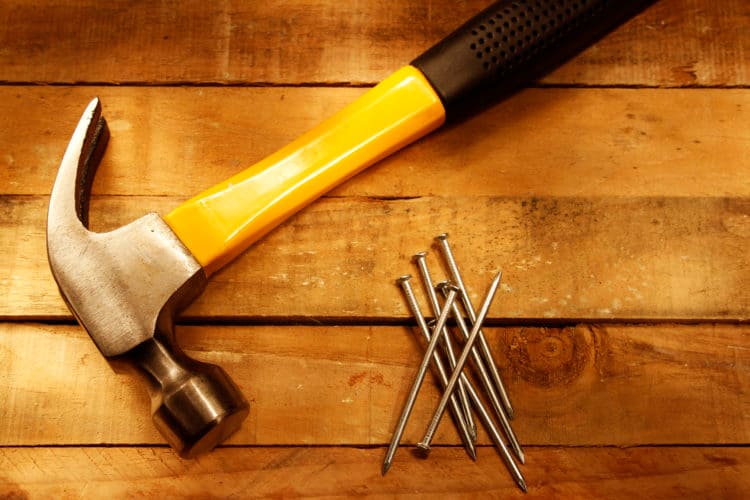 Hammer and nails on wood